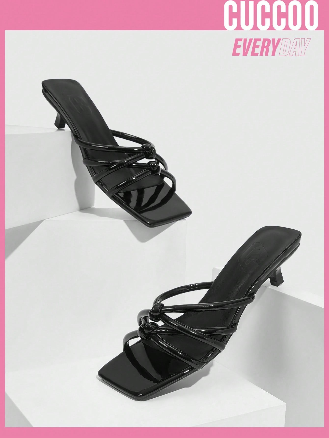 Fashionable high heel black sandals with knot detail and cross strap buckle design for spring and summer.