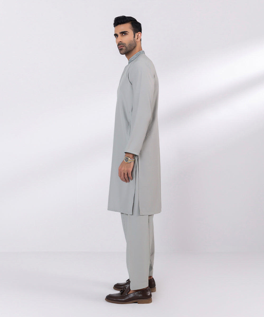 Wash and wear suit with embroidered design.