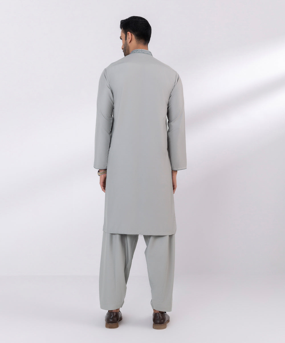 Wash and wear suit with embroidered design.