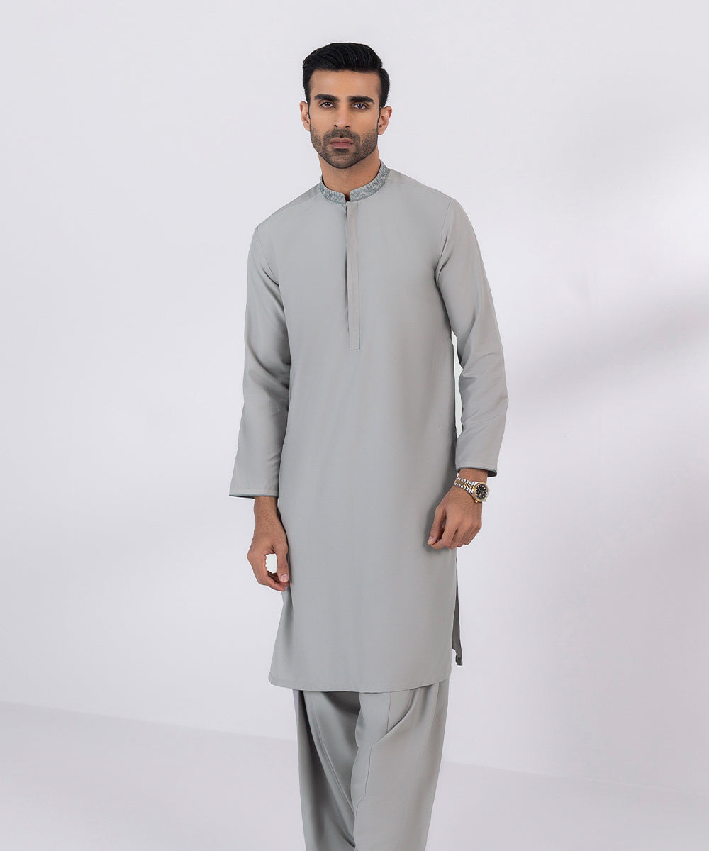 Wash and wear suit with embroidered design.